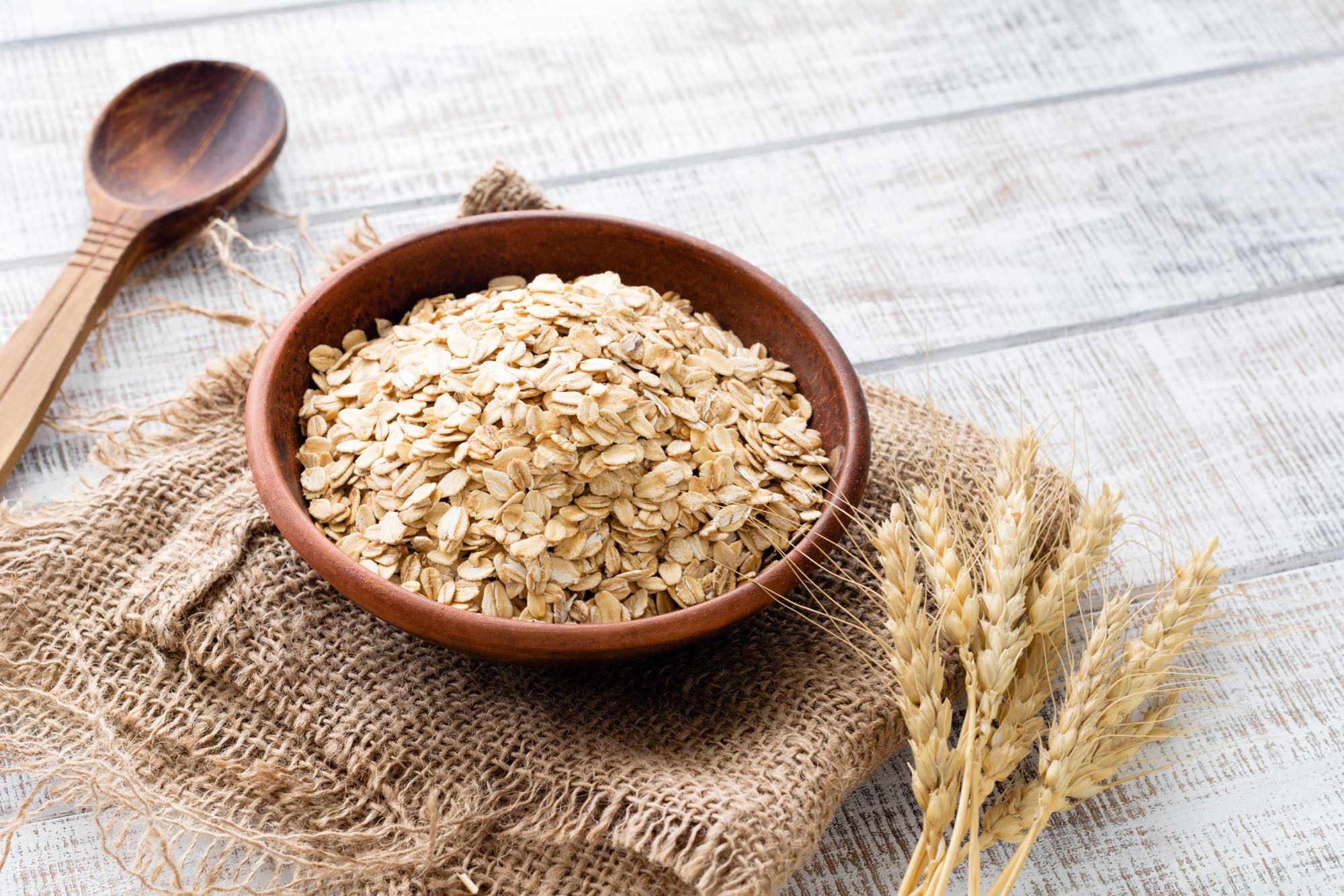 Bowl of oats on a wooden table